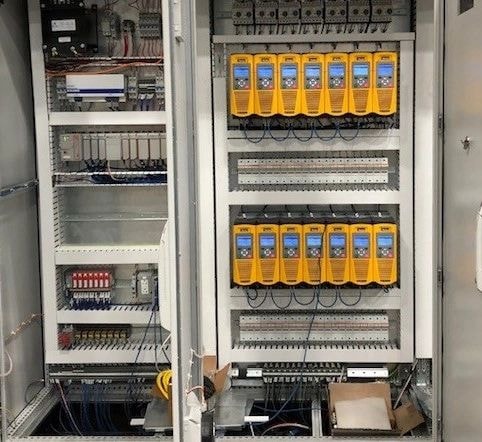 Industrial control panel with relay modules and wiring